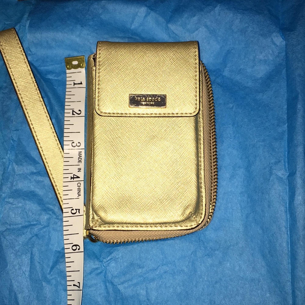Kate Spade Gold cell phone case for small phone and credit cards.